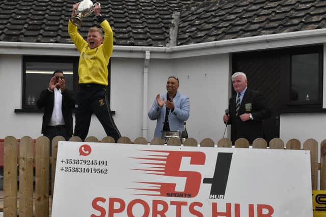 Fox Lodge captain, Aaron Heywood, nearly clears the pavilion as he jumps for joy after finally getting his hands on the Sports Hub North West Senior Cup in Eglinton on Saturday. (Photo: Lawrence Moore)