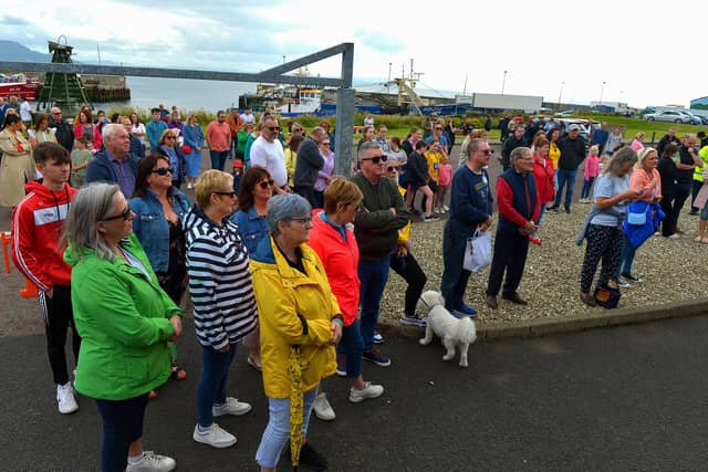 Some of the attendance at the Annual Blessing of the Greencastle fishing fleet, in the village, on Friday afternoon last. Photo: George Sweeney. DER2231GS – 061