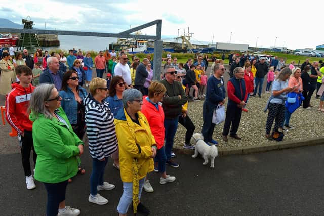Some of the attendance at the Annual Blessing of the Greencastle fishing fleet, in the village, on Friday afternoon last. Photo: George Sweeney.  DER2231GS – 061