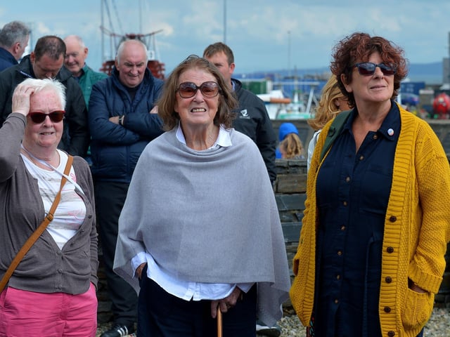 Some of the people who attended at the Annual Blessing of the Greencastle fishing fleet, in the village, on Friday afternoon last. Photo: George Sweeney. DER2231GS – 066