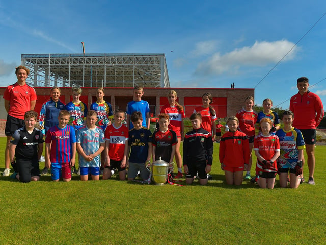 Young Gaels who took part in the Sean Dolan’s Cul Camp held on Tuesday last pictured with the Anglo Celt Cup and County players Donncha Gilmore and Ben McCarron . Photo: George Sweeney. DER2232GS – 005