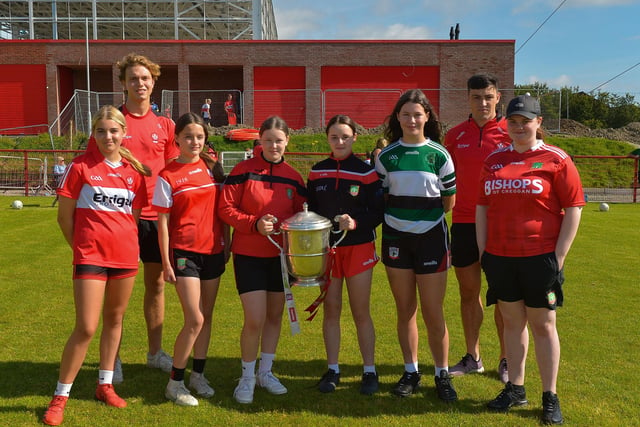 Girls from the Under 15 team pictured with the Anglo Celt Cup and County players Donncha Gilmore and Ben McCarron at the Sean Dolan’s Cul Camp on Tuesday last. Photo: George Sweeney.  DER2232GS – 007