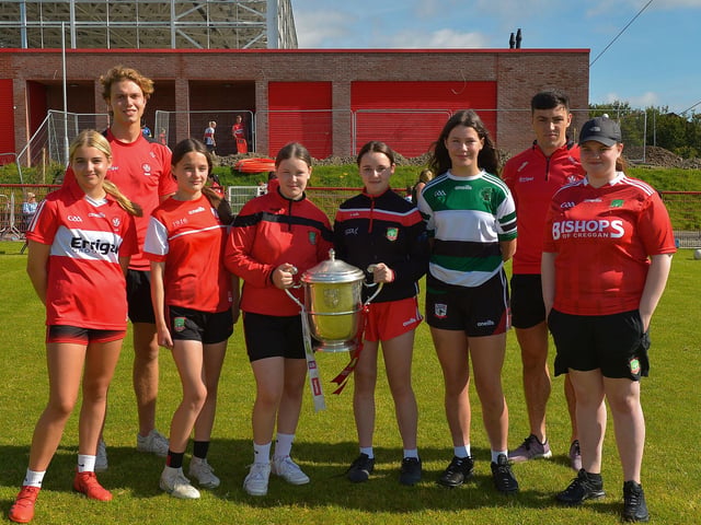 Girls from the Under 15 team pictured with the Anglo Celt Cup and County players Donncha Gilmore and Ben McCarron at the Sean Dolan’s Cul Camp on Tuesday last. Photo: George Sweeney. DER2232GS – 007