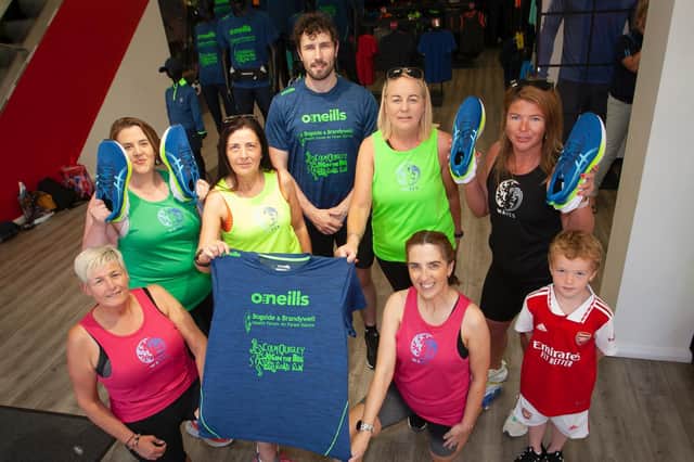 Derry's Ironman Danny Quigley pictured with some of the runners from Waves Running Club at Wednesday's 'Jog in the Bog' launch at O'Neills Sports Superstore, Derry. This year's event will take place on Thursday, 18th August. (Photos: Jim McCafferty Photography)