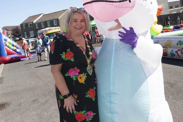 Mayor Sandra Duffy with one of the many colourful characters on display at Thursday's event.