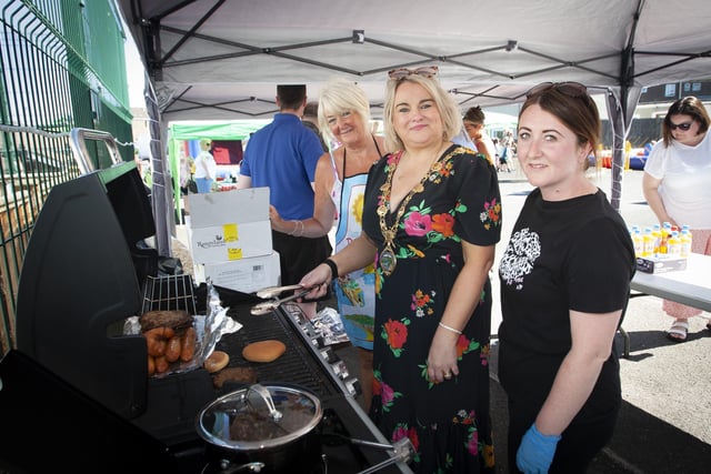 Mayor Sandra Duffy helping out at the barbecue on Thursday with Yvonne and Aisling Graham.