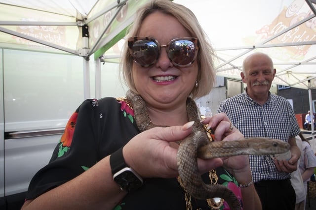Snakes no problem for Mayor Sandra Duffy at Thursday's Leafair Summer Fun Day.