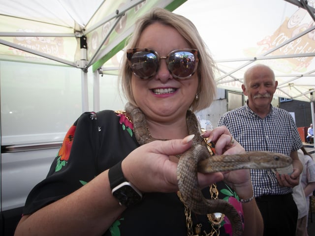 Snakes no problem for Mayor Sandra Duffy at Thursday's Leafair Summer Fun Day.