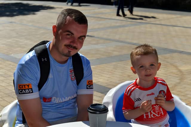 Fiachra Carton and his dad Kyle enjoy the hot weather in Derry yesterday afternoon. Photo: George Sweeney. DER2232GS – 024