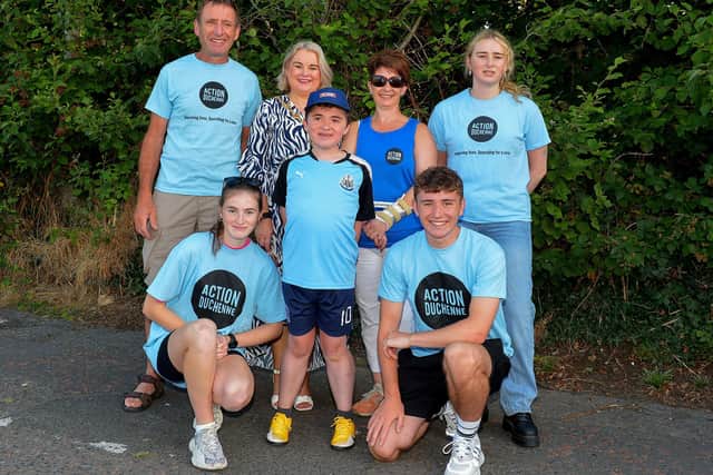 Fifteen-year-old Niall O’Doherty pictured Mayor Sandra Duffy and his family, dad Kevin, mum Deborah, Ciara, Eimear and Oran before setting off on his walk, on Saturday morning, from Bay Road to the Peace Bridge, to raise money for Action Duchenne. Photo: George Sweeney.  DER2232GS – 040