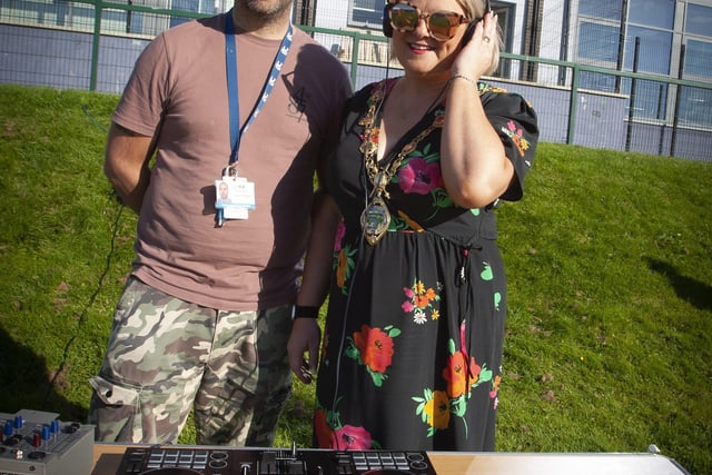 WHO'S THE DJ? . . . .Mayor, Sandra Duffy helping out DJ Martin Gallagher at the Shantallow 'Party in the Park' on Thursday evening last. (Photos: Jim McCafferty Photography)