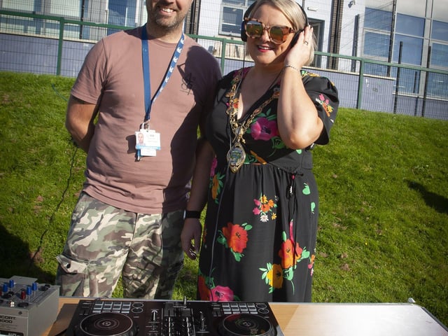 WHO'S THE DJ? . . . .Mayor, Sandra Duffy helping out DJ Martin Gallagher at the Shantallow 'Party in the Park' on Thursday evening last. (Photos: Jim McCafferty Photography)