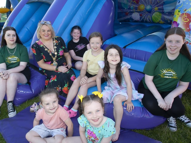 Community Summer Scheme volunteers and sisters Cara and Nicola Donegal pictured with the Mayor Sandra Duffy and some of the youngsters enjoying Thursdayâ€TMs †̃Party in the Parkâ€TM, in Shantallow.