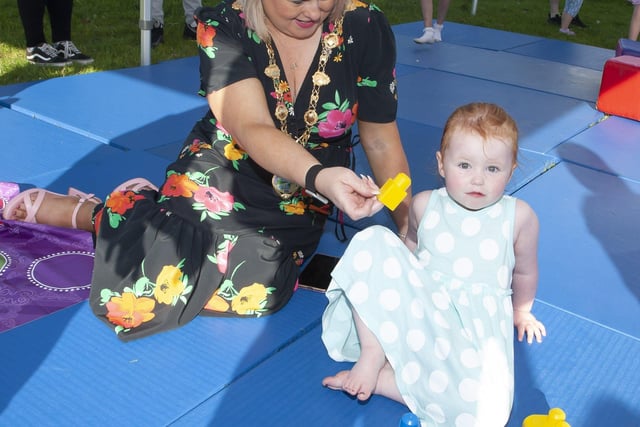 Mayor Sandra Duffy entertains 2 year-old Alayah Doherty at Thursday's 'Party in the Park'.