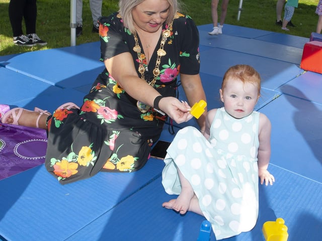 Mayor Sandra Duffy entertains 2 year-old Alayah Doherty at Thursday's 'Party in the Park'.