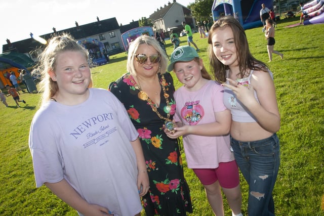 The Mayor shows off her chain of office at the 'Party in the Park' to Grace and Neveah Fitzgerald and MaryKate Crumlish on Thursday in Shantallow.