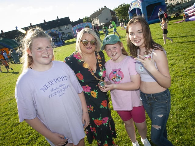 The Mayor shows off her chain of office at the 'Party in the Park' to Grace and Neveah Fitzgerald and MaryKate Crumlish on Thursday in Shantallow.