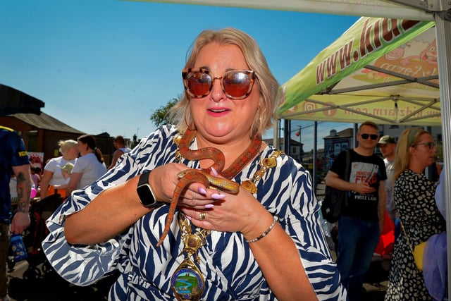 Mayor Sandra Duffy bravely puts a snake around her neck at the Gasyard Féile’s Big Bog BBQ on Saturday afternoon last.  Photo: George Sweeney.  DER2232GS – 066