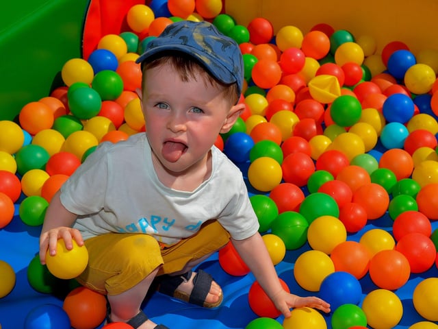 Cillian, age 2, having a good time at the Gasyard Féile’s Big Bog BBQ on Saturday afternoon last.  Photo: George Sweeney.  DER2232GS – 070