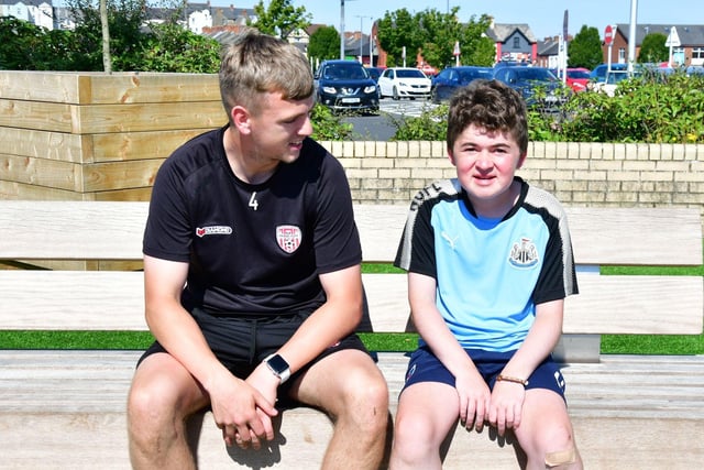 Niall O'Doherty having a break with Derry City player Ciaron Harkin.