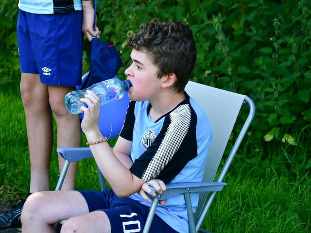 Staying hydrated and having  a rest during his mammoth walk.