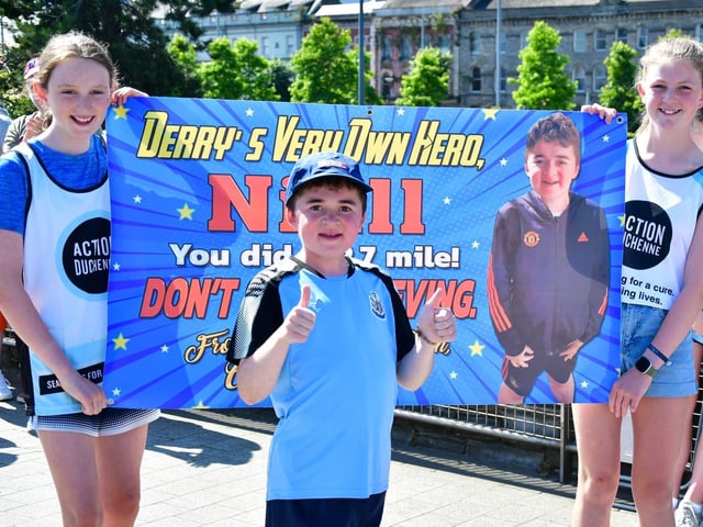 'Derry's very own hero' Niall with supporters as he finished his 2.7 mile walk.