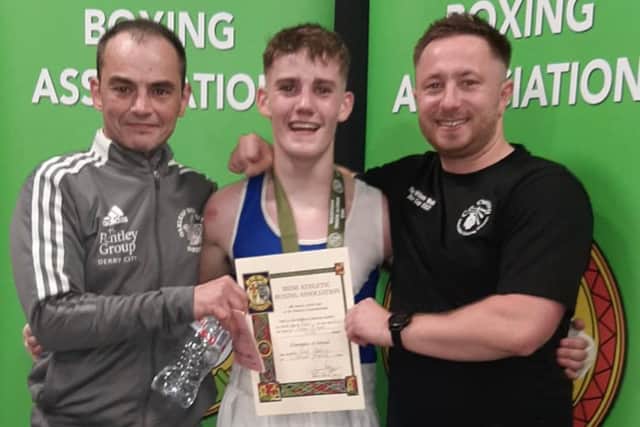 New Irish U18 51kg champion, Jack Harkin from Oakleaf ABC, with his coaches Eugene O'Kane Jnr (left) and Raymond Rogan in Dublin on Sunday