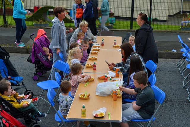 Locals enjoying a snack at the Wan Big Street Party held in Creggan on Monday afternoon. Photo: George Sweeney.  DER2233GS – 020