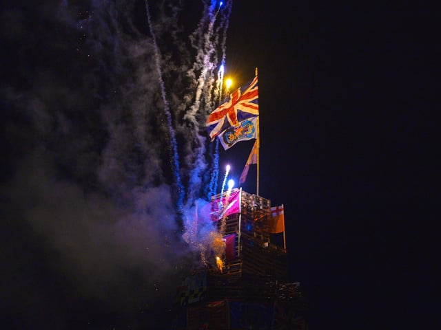 Fireworks on top of the bonfire in Meenan’s Square before it was set alight on Monday night. DER2233GS – 029