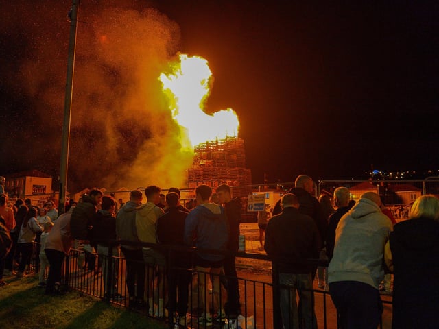 Spectators at the bonfire in Meenan’s Square on Monday night. DER2233GS – 032