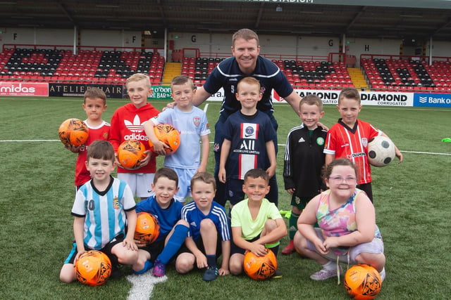Youngsters in the 6-7 years age group being pictured with coach Martin Doherty on Monday  at the Ryan McBride Summer Soccer Academy in the Brandywell. (Photos: Jim McCafferty Photography)
