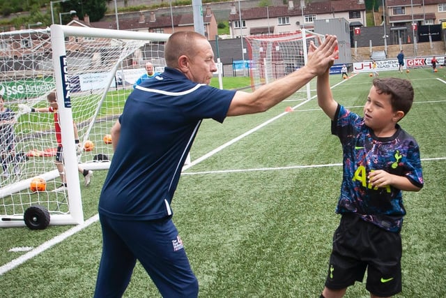 'High fives' for a job well done at the Ryan McBride Summer Soccer School this week. (Photo: Jim M cCafferty)