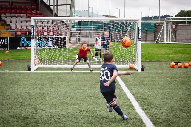 PICK IT OUT: A young player finds the top corner during one of Monday's drills at the Ryan McBride Soccer Academy. (Photo: Jim McCafferty)