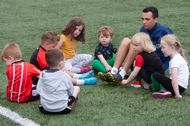 Coach Paul O'Donnell working with some of the 3-5 year olds during the Ryan McBride Summer Soccer Academy at Brandywell Stadium on Monday afternoon. (Photo: Jim McCafferty)