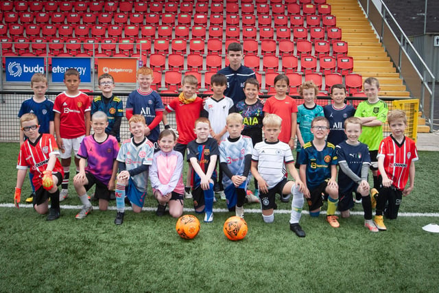 The 8-9 years age group pictured with coach, Eoghan Gallagher, at the Brandywell on Monday afternoon.