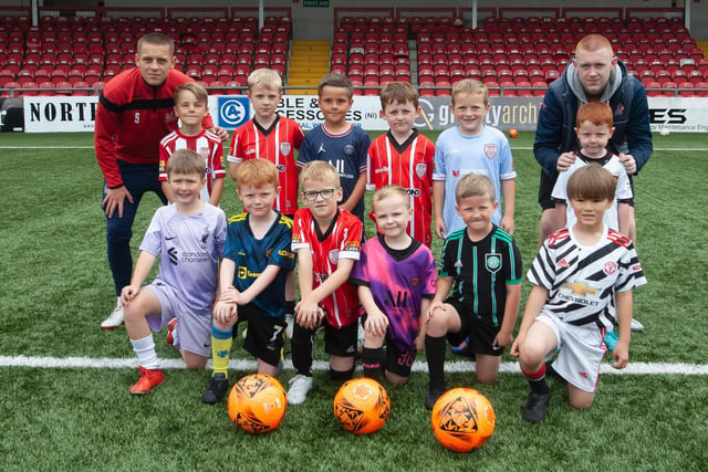 Coaches Jack Malone and Dylan Watson pictured with another group of 6-7 year-olds at the summer academy at Brandywell on Monday. (Photo: Jim McCafferty)