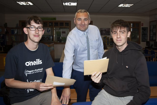 Senior Teacher Mr. Gerry Beattie pictured with A Level students Shea Gallagher and Adam Gallagher after they picked up their results on Thursday morning.