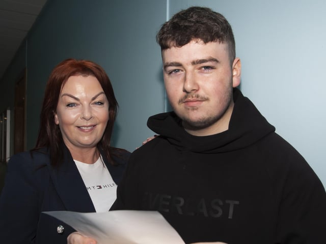 Mum Tina McSwine helping son Aodhfin check his A Level results at St. Josephâ€TMs. He picked up 2 As and 1C.