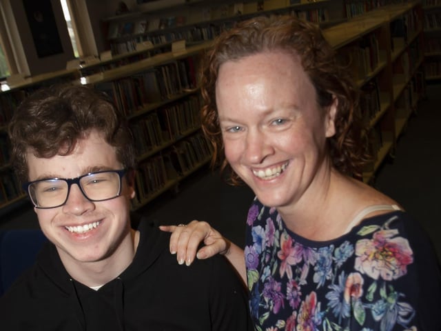 St. Josephâ€TMs A Level student Odhran Harkin is congratulated by his mum Shona.