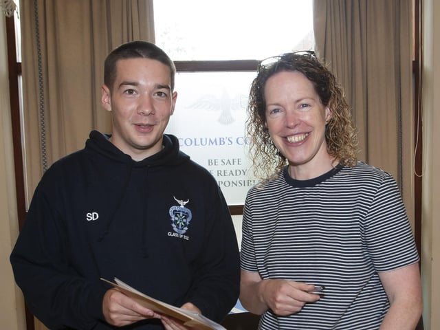 St. Columbâ€TMs College A Level student Shane Deery is congratulated by his biology teacher Mrs. Ursula Grimley yesterday.