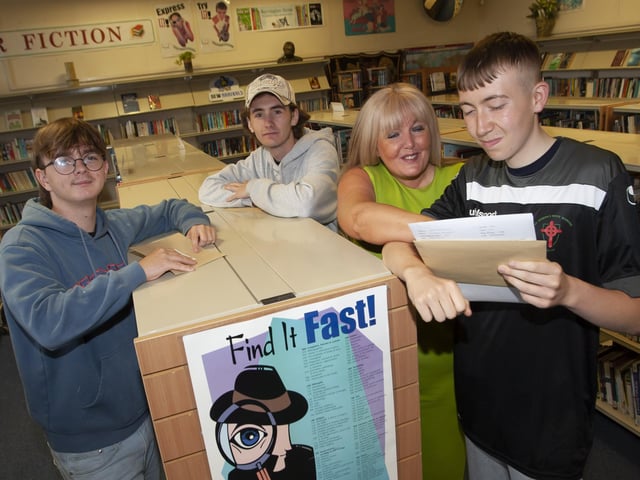 Principal Designate Mrs Ciara Deane checking A Level results with students at St. Josephâ€TMs Boys School on Thursday morning. From left, Chea McMonagle, Madox Thompson and Conghaile McLaughlin.