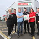 Colm and Oonagh McGinley celebrating with their staff members Donna Gillespie, Leo Nicholl, Luke McLaughlin, Fontaine Porter and Shauna McElhinney.