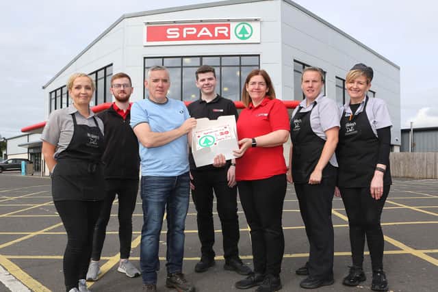 Colm and Oonagh McGinley celebrating with their staff members Donna Gillespie, Leo Nicholl, Luke McLaughlin, Fontaine Porter and Shauna McElhinney.