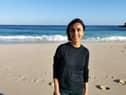 Presenter Anita Rani standing on Porthcurno beach