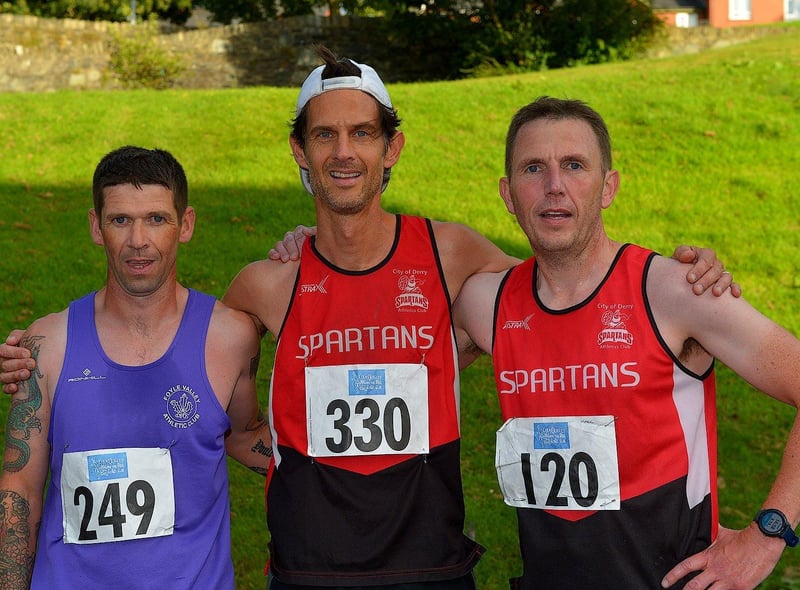 Spartan Allan Bogle (centre) won the 2022 Colm Quigley Jog in the Bog on Thursday evening last. Matt McLaughlin, Foyle Valley was placed second and Mark Mullen, Spartans was third. Photo: George Sweeney.  DER2233GS – 035