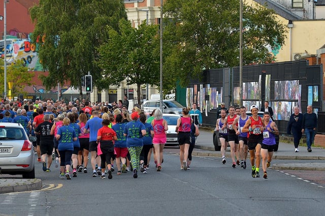The leading pack runs along Rossville Street during the Colm Quigley Jog in the Bog on Thursday evening last. Photo: George Sweeney.  DER2233GS – 042