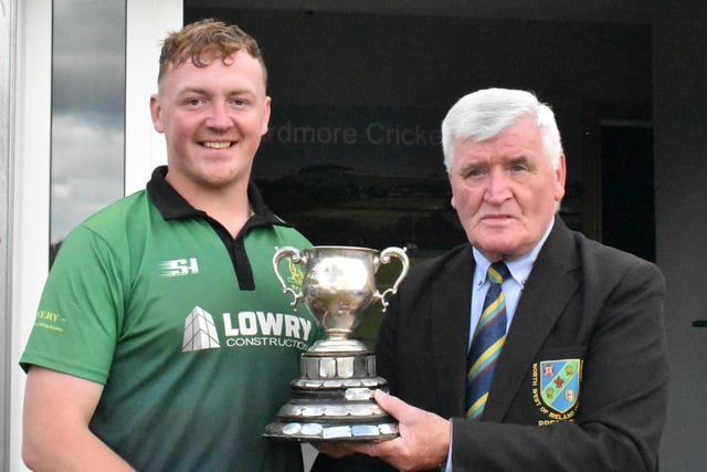 North West Cricket Union President Connie McAllister presents League 3 title trophy to Graeme Fitzpatrick, captain of North Fermanagh