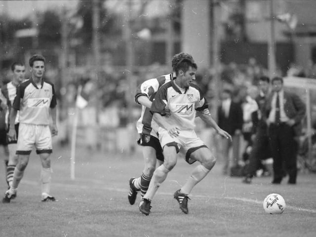 Substitute Ryan Coyle puts the pressure on.