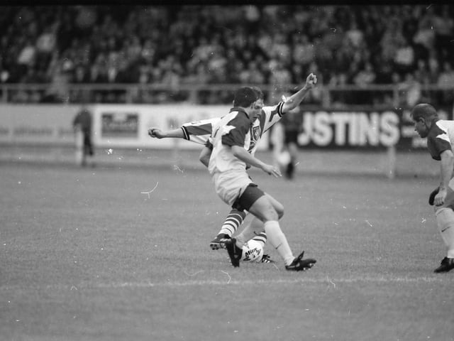 Tom Mohan is closed down by the Maribor defence.