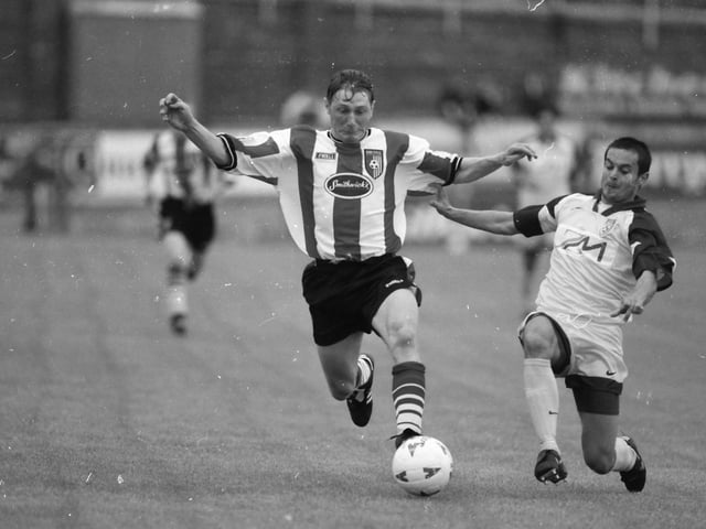 Maribor defender Marinko Šarkezi challenges Tom Mohan.